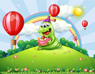 一个快乐的绿色怪物 庆祝他在山顶的生日图片