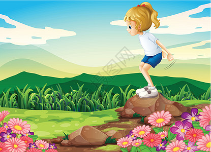 一个年轻女孩在山顶玩耍 带着岩石和花园图片