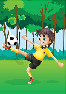 一个在森林踢足球的男孩活动圆圈分支机构男性树木球赛男生球形树叶绅士图片