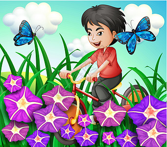 一个男孩在花园里骑自行车 带着鲜花和蝴蝶图片