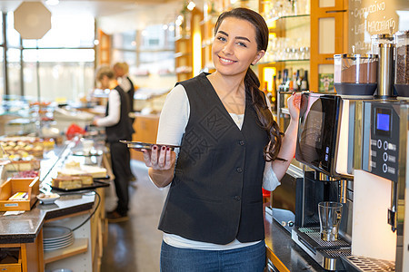 咖啡店或餐馆和咖啡机的女服务员营业员店主员工服务可可服务器工作职员零售咖啡图片