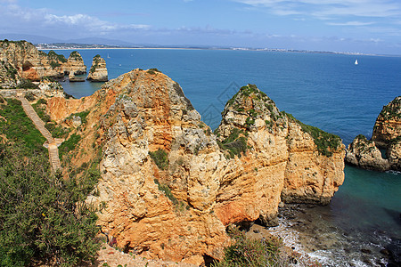 悬崖支撑石窟旅游旅行赭石海岸线蓝色侵蚀风景海岸图片