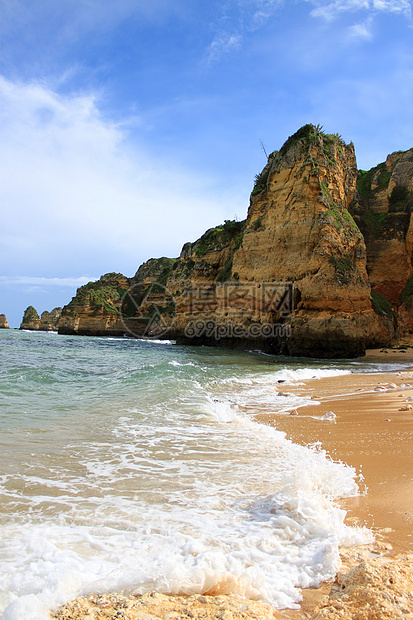 葡萄牙拉各斯悬崖旅游蓝色岩石海岸晴天旅行海岸线海滩海洋图片