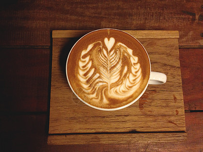拿铁咖啡艺术一杯咖啡加拿铁艺术食物牛奶杯子背景