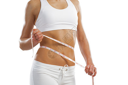腰部的年轻运动女性橘皮身体饮食组织肥胖数字测量女士腰围磁带图片