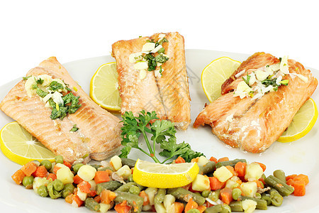 白碗上的三文鲑鱼和蔬菜图片