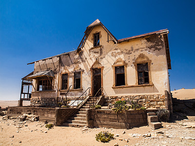 Kolmanskop鬼城的军需官家建筑游客旅行孤独钻石沙丘勘探建筑学墙壁历史性图片