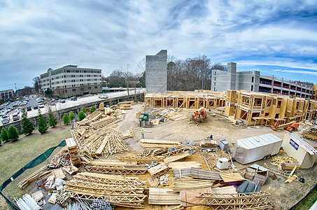 城市中繁忙的建筑工地建筑学帽子黄色工业工作安全盘子地面蓝色安全帽图片