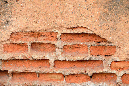 旧的红红色石板砖墙石头石膏长方形石工接缝建筑石墙风格黏土水泥图片