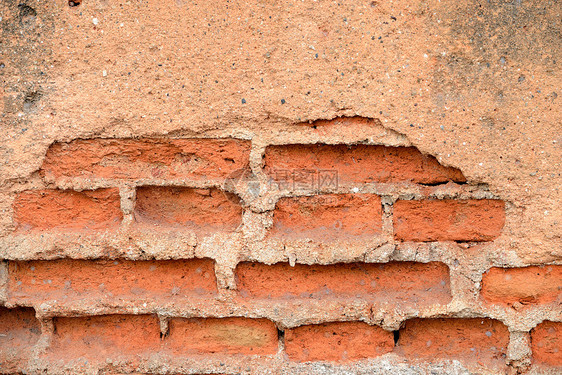 旧的红红色石板砖墙石头石膏长方形石工接缝建筑石墙风格黏土水泥图片
