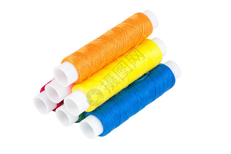 白色背景上的彩色线条库针线活筒管线圈团体橙子刺绣衣服工艺材料纺织品图片