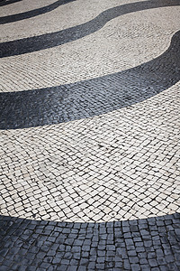 和Beige 古代黑白石路面鹅卵石卷曲小路褐色石头正方形街道人行道马赛克岩石图片
