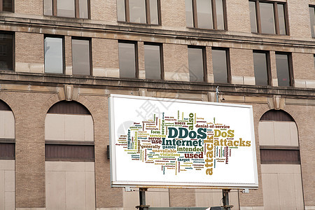 在砖墙上挂有 DDOS 字云符号的广告广告公告牌金融框架海报建筑学商业办公室水平城市白色蓝色图片