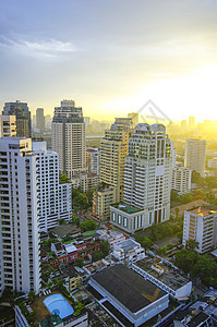 曼谷市上午旅行街道摩天大楼场景建筑物天空全景建筑学橙子日落图片