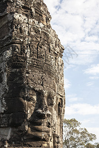 Bayon面对吴哥汤姆 柬埔寨暹粒纪念碑丛林高棉语寺庙宗教雕刻石头建筑学收获岩石图片