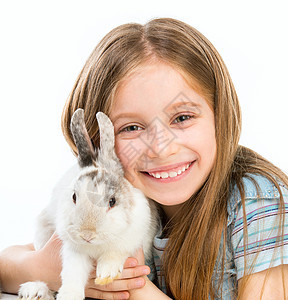 带兔子的小女孩耳朵白色动物毛皮孩子乐趣女孩农场野兔宠物图片