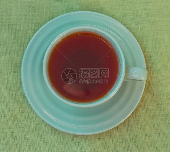 绿色茶杯 从上方查看飞碟咖啡柠檬棕色花草香气餐具茶包红茶黑色图片