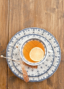 一杯茶加一片柠檬红茶茶杯冰糖食物盘子绿茶饮料杯子乡村图片