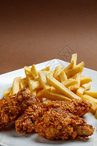 炸鸡翅美食食物午餐棕色油炸小吃垃圾餐厅背景盘子图片