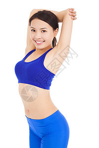 美丽的漂亮漂亮的女人 伸展她的手臂 微笑着笑容力量女孩重量健身房运动员减肥训练身体肌肉运动装图片