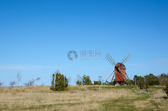 旧式传统风车绿色蓝色翅膀地标天空红色遗产活力文化力量图片