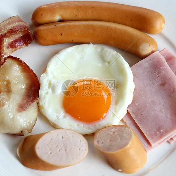 早餐餐果汁咖啡橙子食物餐厅火腿蛋黄油炸香肠面包图片