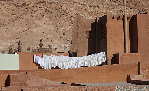突尼斯Tamerza沙漠旅馆石头蓝色卧室异国旅游住宿假期阳光照射情调窗户图片