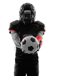 美国足球运动员 拿着足球球的轮光灯制服球衣剪影工作室球员人像运动男人图片