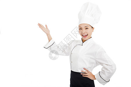 年轻女厨师举起手来展示一些东西图片