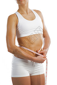 腰部的年轻运动女性组织重量营养饮食磁带腰围训练健身房腹部皮肤图片