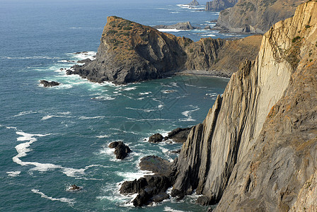 悬崖巨石岩石海滩地标砂岩镜子国家旅行日出风景图片