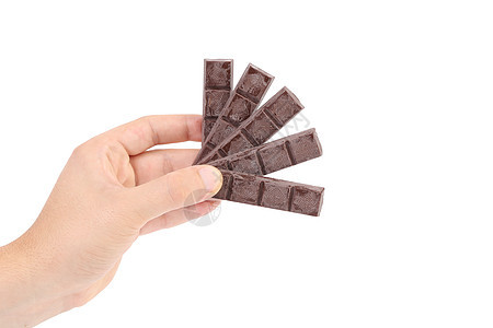 手握着巧克力棒巧克力沙漠可可工作室奶油饮食营养食物扇子小吃图片