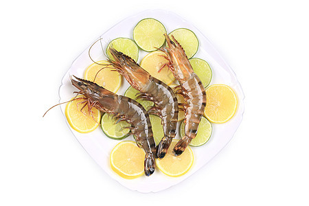 生虾盘加柠檬和石灰营养贝类养殖美食盘子动物海鲜甲壳食物黄色图片
