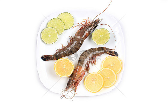 盘子里有生虎虾营养养殖午餐绿色贝类动物健康美食柠檬饮食图片