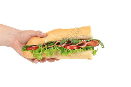 新的大三明治在手里沙拉面包芝麻家禽种子熏制蔬菜小吃火腿食物图片