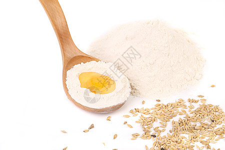 鸡蛋和勺子烘烤杂货食物小麦白色烹饪黄色面粉厨房亚麻图片