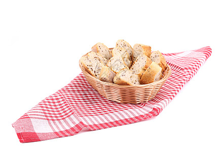 餐桌布上有面包片的韦克篮子小麦桌布脆皮粮食向日葵收成早餐面包营养柳条图片