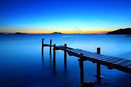 日落的海景与木制码头天空海洋蓝色海景海滩支撑木头海岸线海岸码头图片