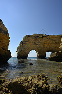 洞穴反射日出场景砂岩镜子水库橙子蓝色海滩岩石图片