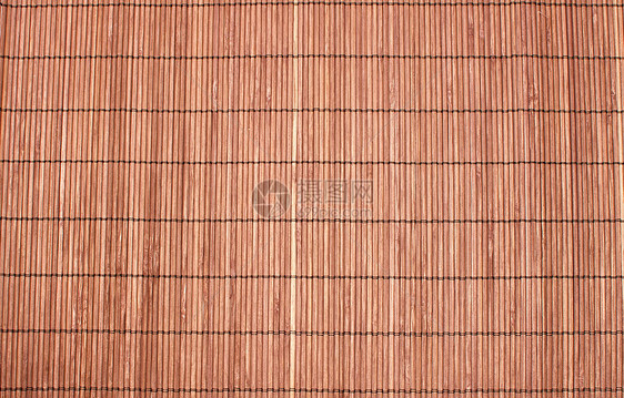 上面的顶部观点 作为抽象纹理背景构成的竹子棕色草垫材料编织宏观稻草寿司芦苇工艺小地毯传统装饰图片