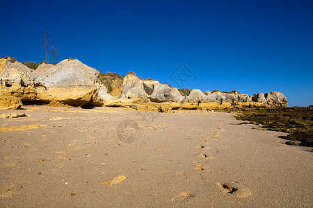 海滩沙滩地标反射悬崖砂岩巨石海洋旅行国家环境娱乐图片