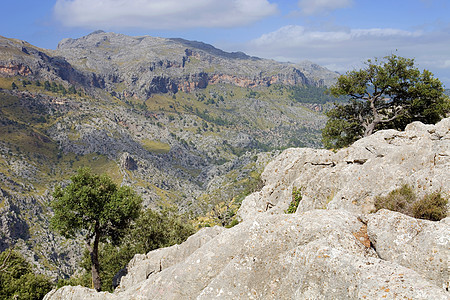 山脉天空旅游悬崖爬坡岩石海岸太阳假期石头旅行图片