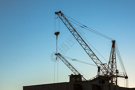 建筑起重机天空商业项目机器工程金属财产座舱吊装活力背景图片