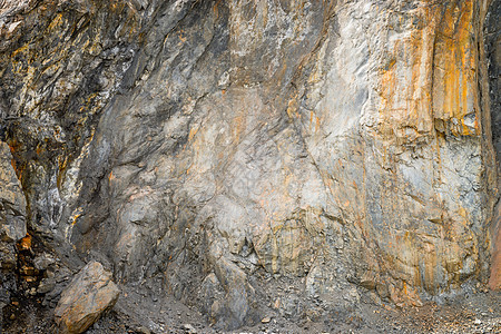 采石场的石灰岩石头矿物石灰石矿石花岗岩挖掘机天空材料岩石地面图片