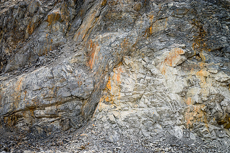采石场的石灰岩矿石蓝色工业花岗岩挖掘机矿物碎石黄色天空材料图片