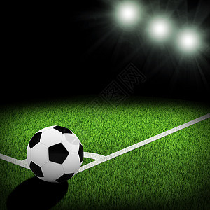 由聚光灯照亮的夜间足球场阴影草地足球照明游戏体育场角落条纹绿色操场图片