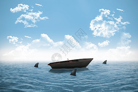 在海洋中小船盘旋的鲨鱼支撑环境危险晴天风险木头帆船天气蓝天海岸线图片