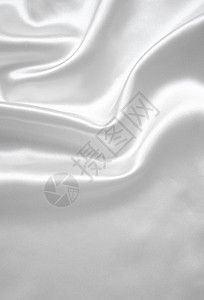 平滑优雅的白色丝绸作为背景银色折痕纺织品织物曲线投标材料新娘海浪布料图片