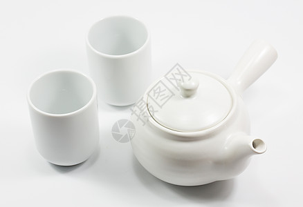 孤立的茶壶和玻璃白色背景图片