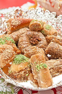 土耳其语甜点糖果火鸡咖啡店蜂蜜文化脚凳坚果面包盘子面团图片